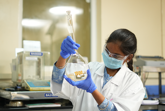 Glochem scientist analyzing volumetric formulation